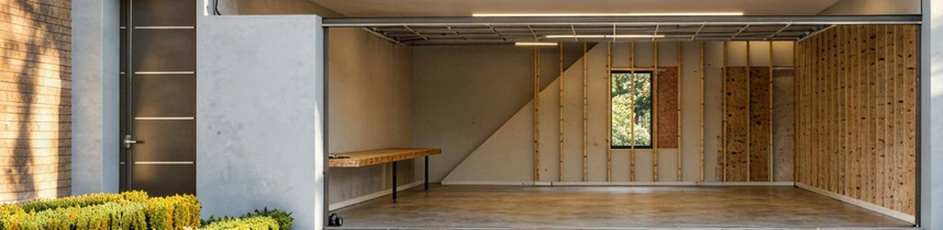 Framed interior of attached garage conversion project by Garage Conversion Pros